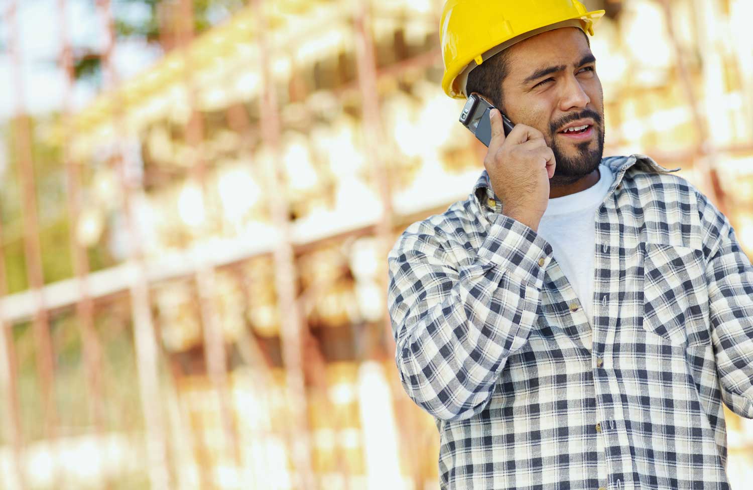 Construction worker on phone